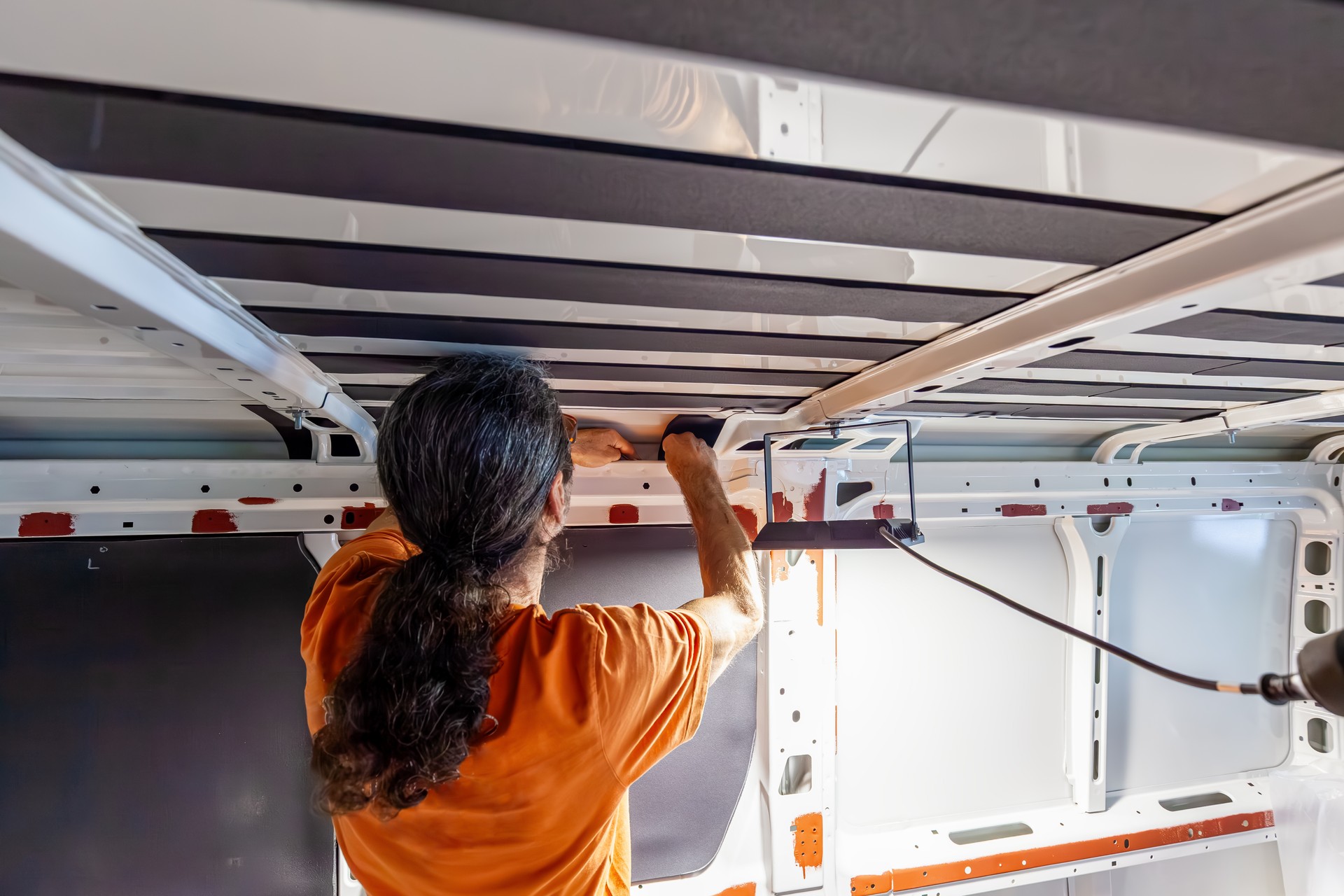 Camper van conversion. Insulation Floor of the transporter, motorhome after anti-rust paint. Conversion DIY Jumper van, foam insulation inside of a camper van